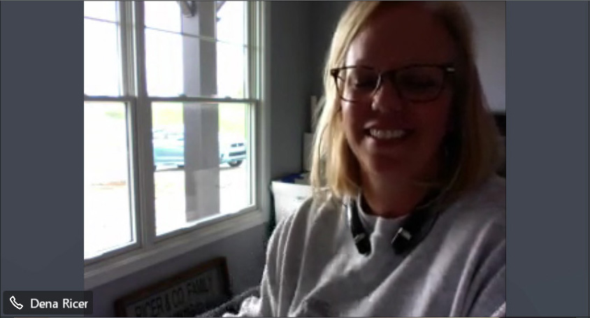 Dena Ricer sits in her home office, which doubles as her laundry room.