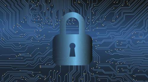 Cybersecurity Padlock over a circuit board