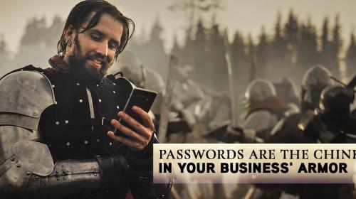 Man in armor looking at cell phone