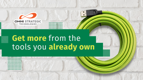 The image features a green USB cable coiled on a white brick background. Text reads, "Get more from the tools you already own." The logo for Omni Strategic Technologies is at the top left.